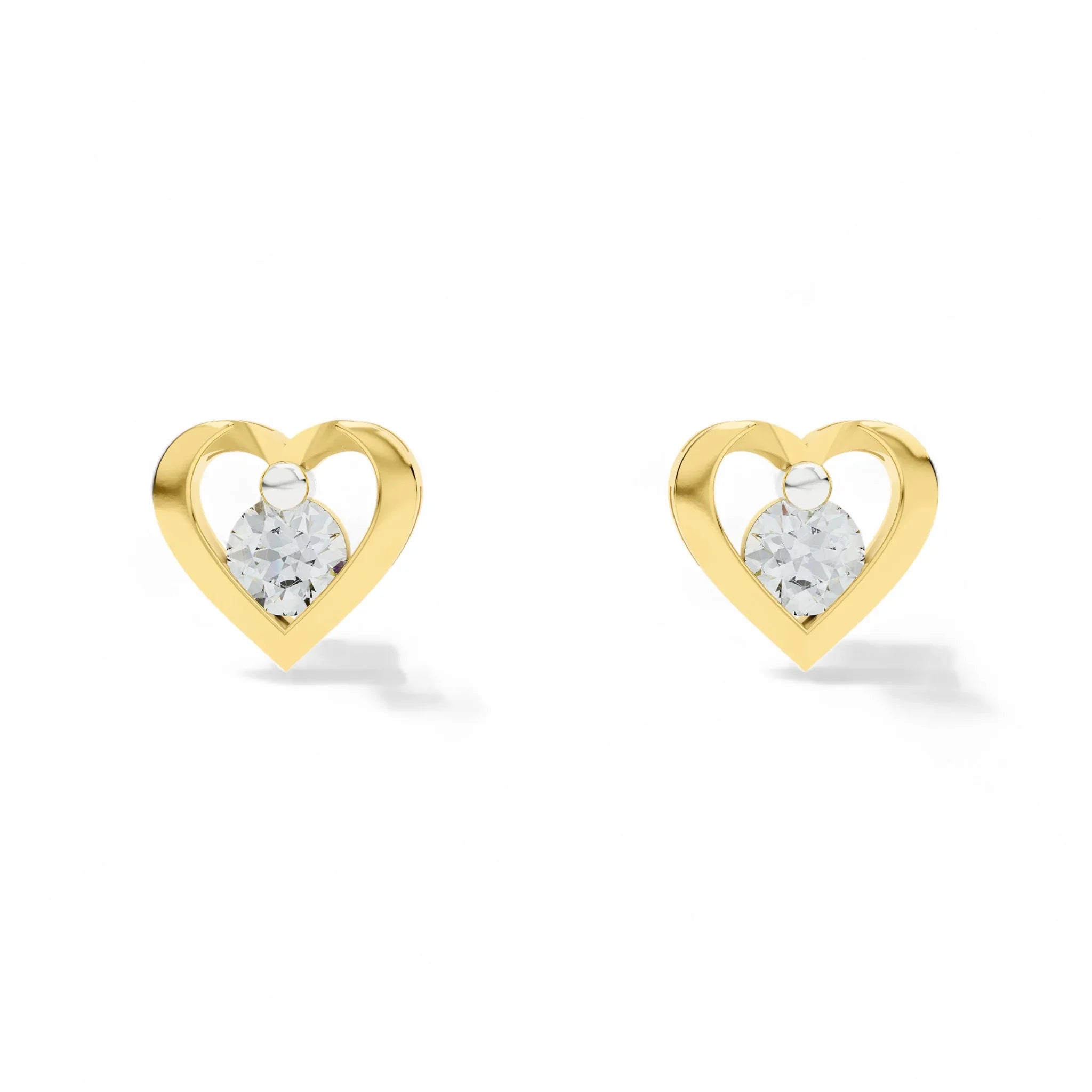 Heart-shaped gold earrings with CZ on a white background