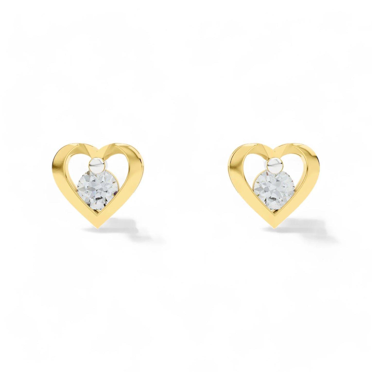 Heart-shaped gold earrings with CZ on a white background