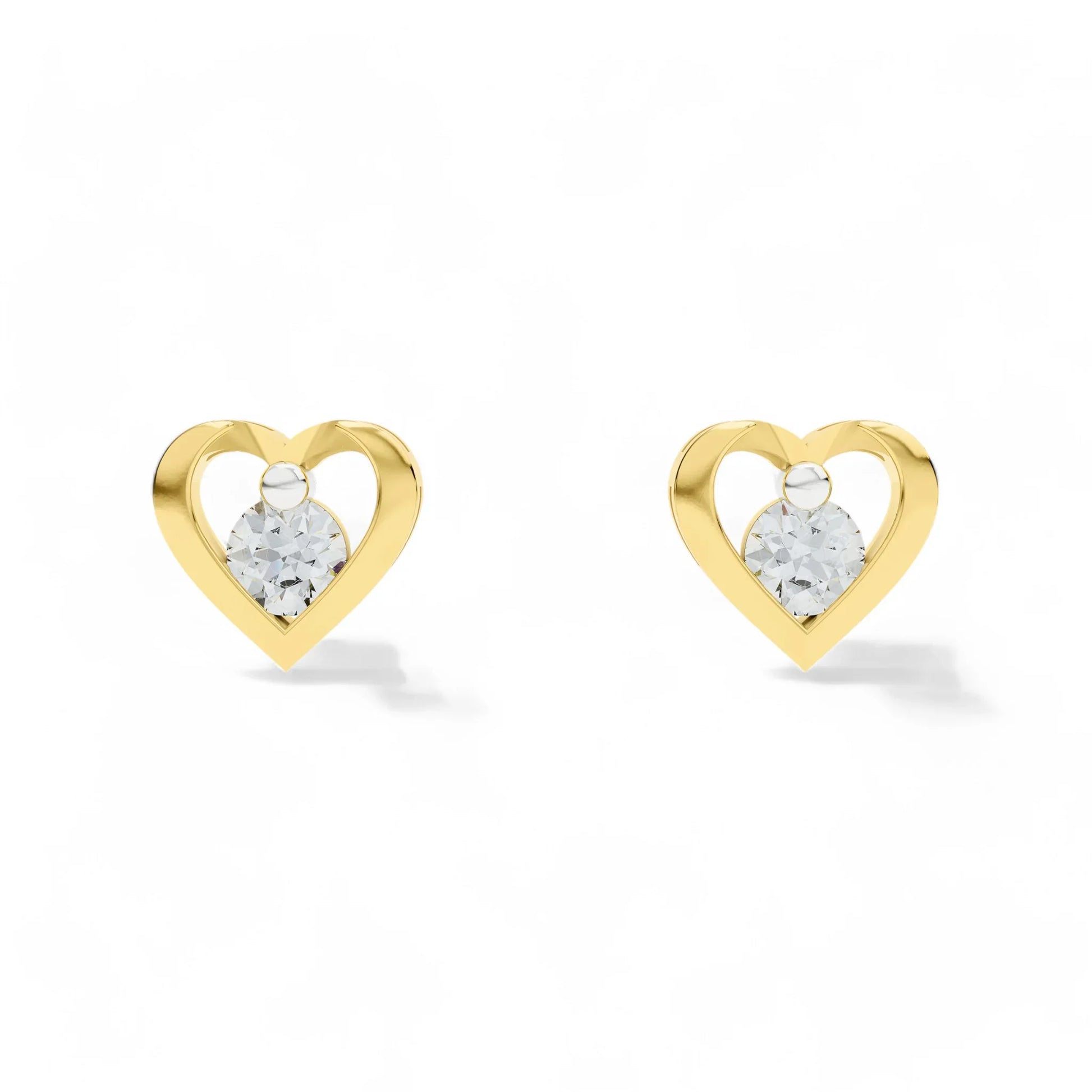 Heart-shaped gold earrings with CZ on a white background