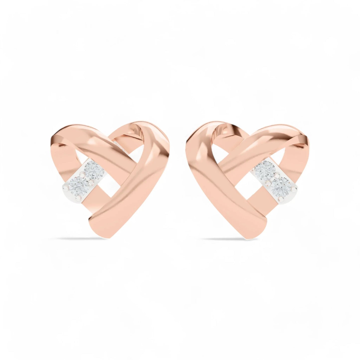 silver rose gold plated heart shaped earrings with embedded CZ on a white background