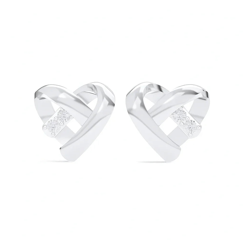 Pair of silver heart-shaped earrings on a white background